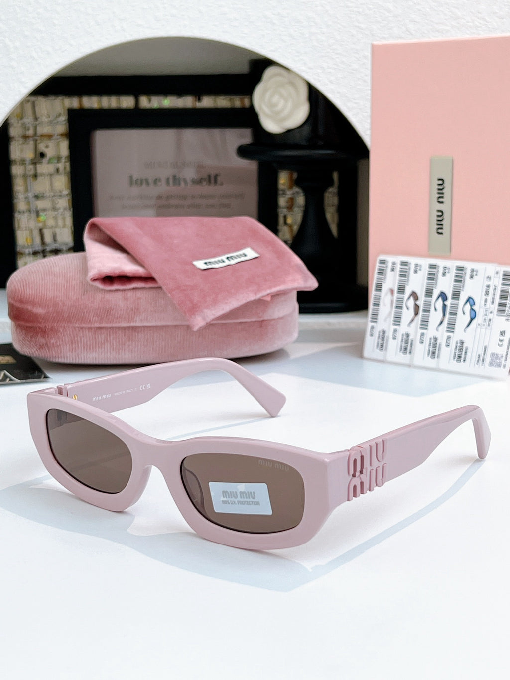 Sunglasses miumiu