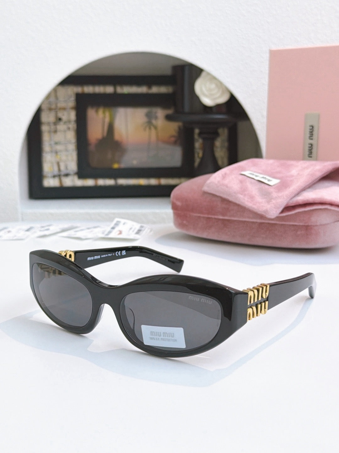 Sunglasses miumiu