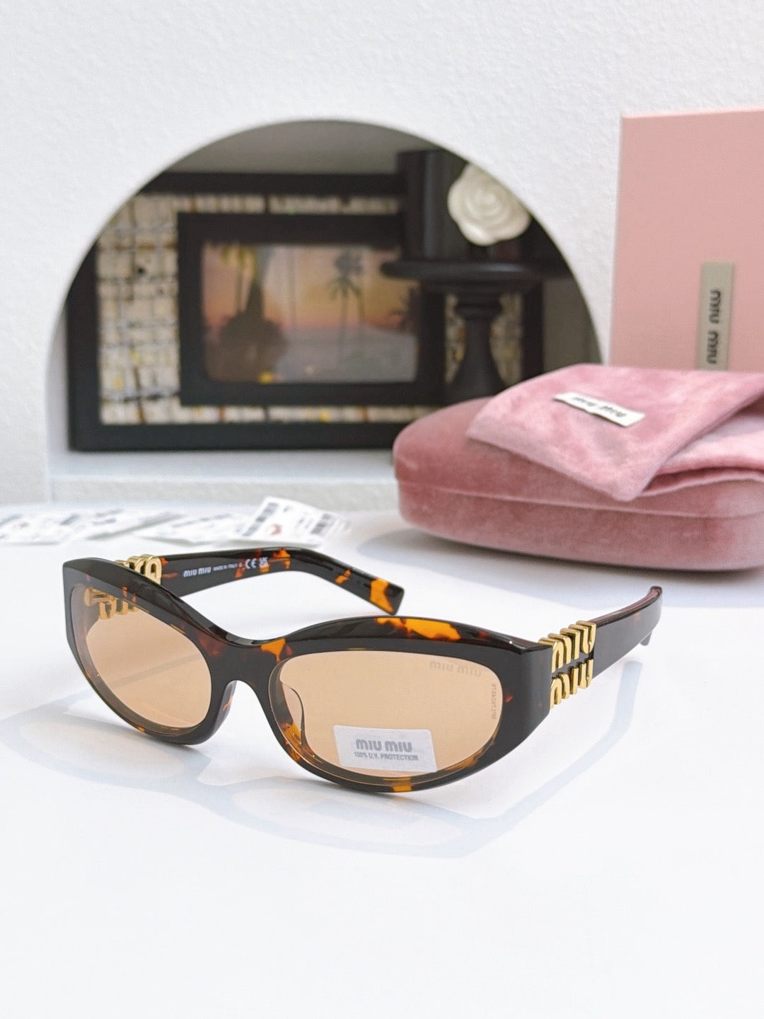 Sunglasses miumiu